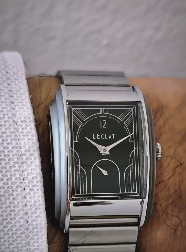 Load video: From sketch to wrist. Experience the completed L'Eclat watch and the unique character of its sculpted Art Deco case.